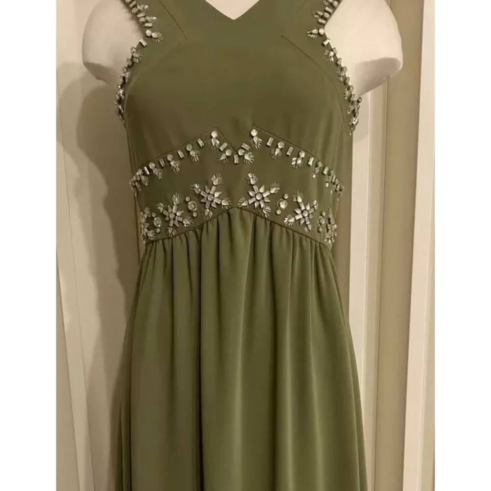 New in perfect condition. It runs a little bit bigger. I am sz 6 - it fits me.